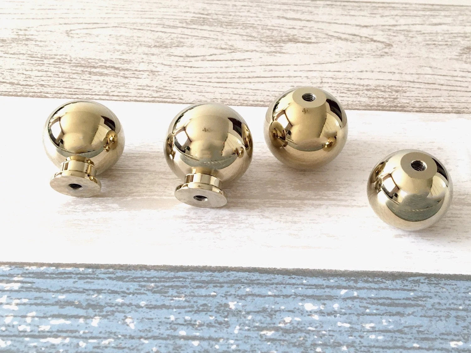 shiny gold sphere drawer knobs for modern kitchen design